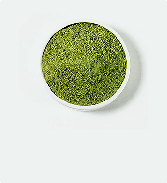 Polvere di kratom verde in ciotola bianca
